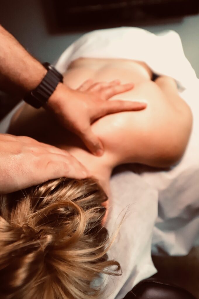 Bruno Panucci RMT giving a neck and shoulder massage at his Brantford in-home practice